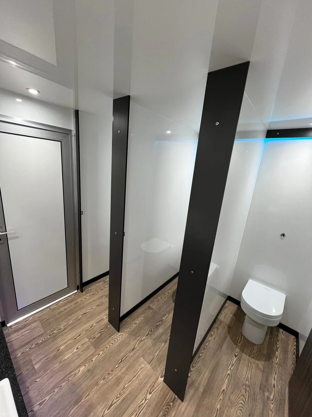 Clean cubicle partitions inside luxury toilet trailer