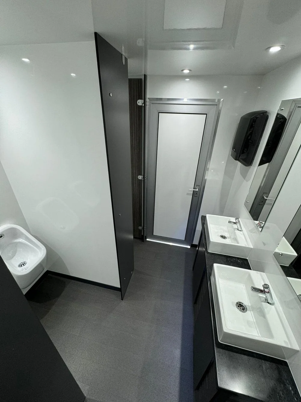Gents urinals with walnut door in luxury wedding toilet trailer