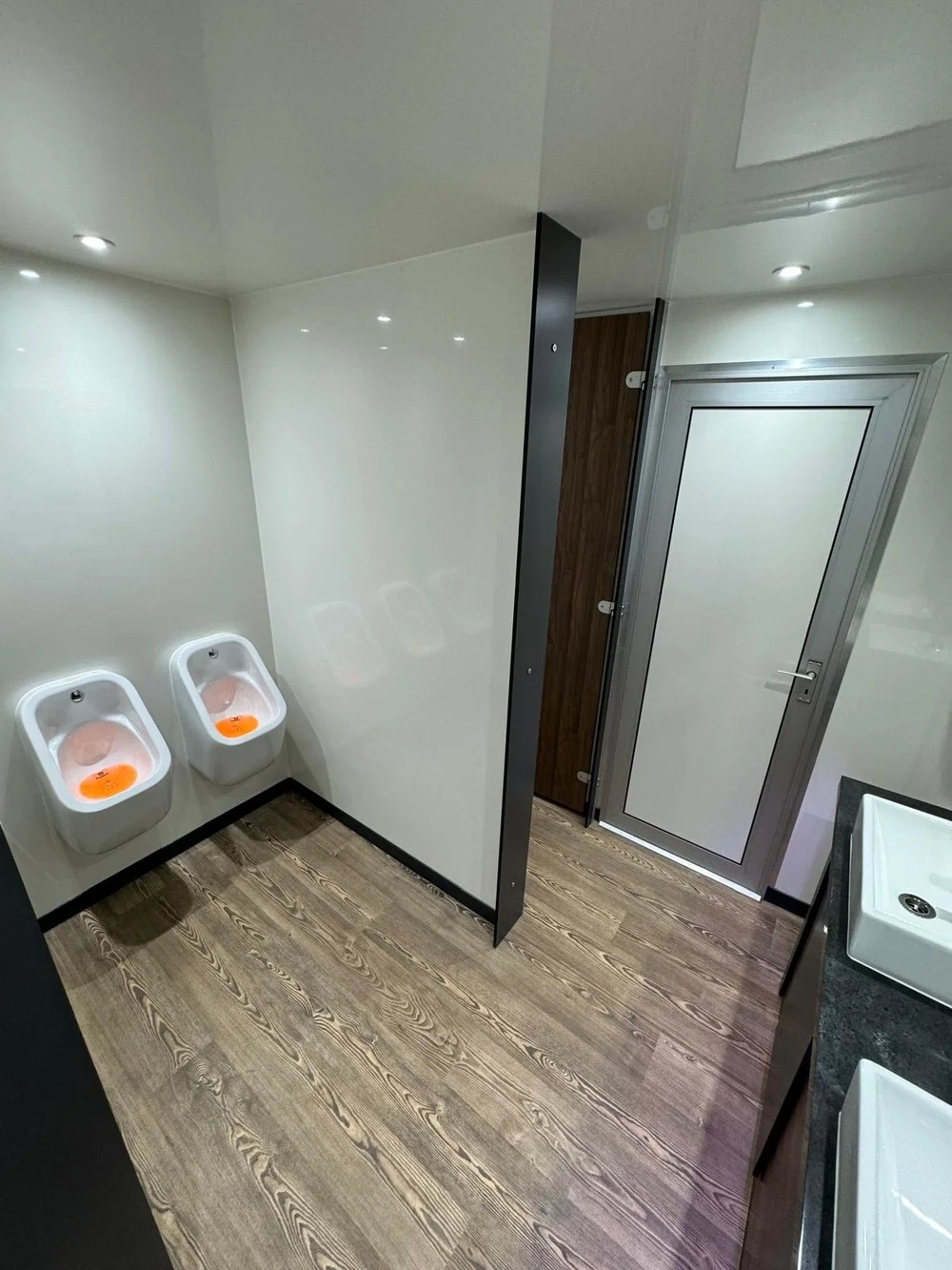 Vanity area with purple mood lighting inside luxury trailer